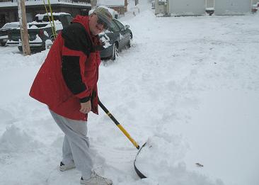 MISC-061201-Tim_Shovels_Snow-Small